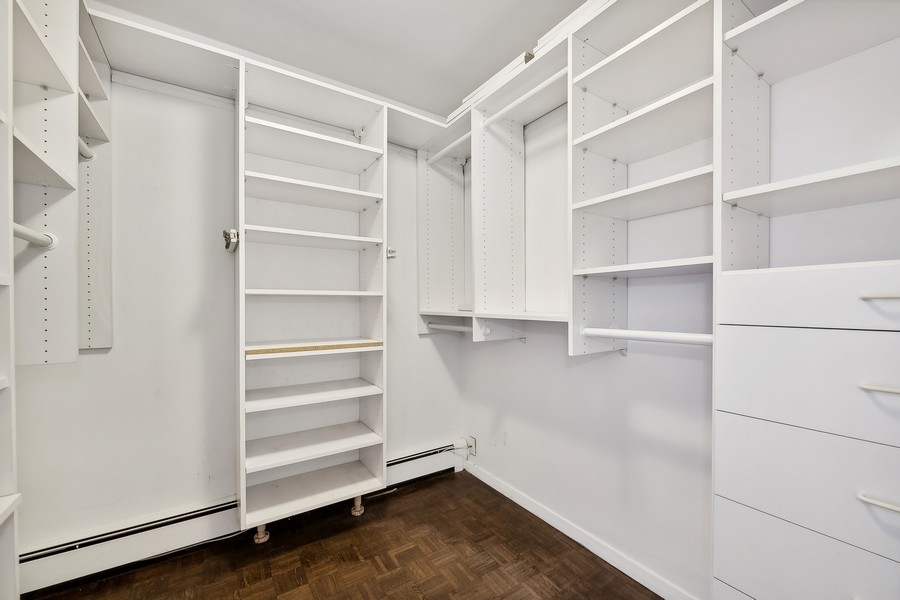 1310 North Ritchie Court, Unit 27B Chicago, IL 60610 - Photo 14 of 31 a view of walk in closet with empty racks