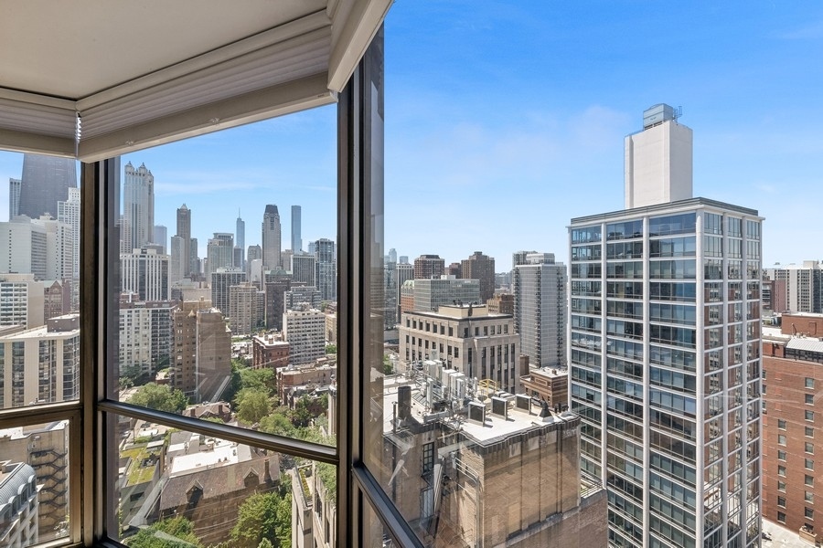 1310 North Ritchie Court, Unit 27B Chicago, IL 60610 - Photo 16 of 31 a view of a balcony with couches