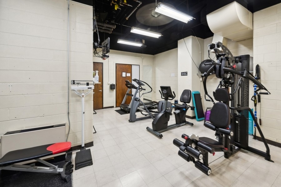 1310 North Ritchie Court, Unit 27B Chicago, IL 60610 - Photo 20 of 31 a view of a room with gym equipment