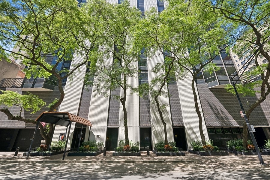 1310 North Ritchie Court, Unit 27B Chicago, IL 60610 - Photo 2 of 31 a view of a street with houses and trees