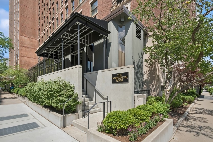 1310 North Ritchie Court, Unit 27B Chicago, IL 60610 - Photo 26 of 31 front view of a house with a yard