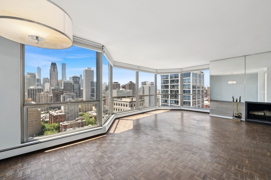 1310 North Ritchie Court, Unit 27B Chicago, IL 60610 - Photo 4 of 31 a view of a living room hardwood floor and staircase