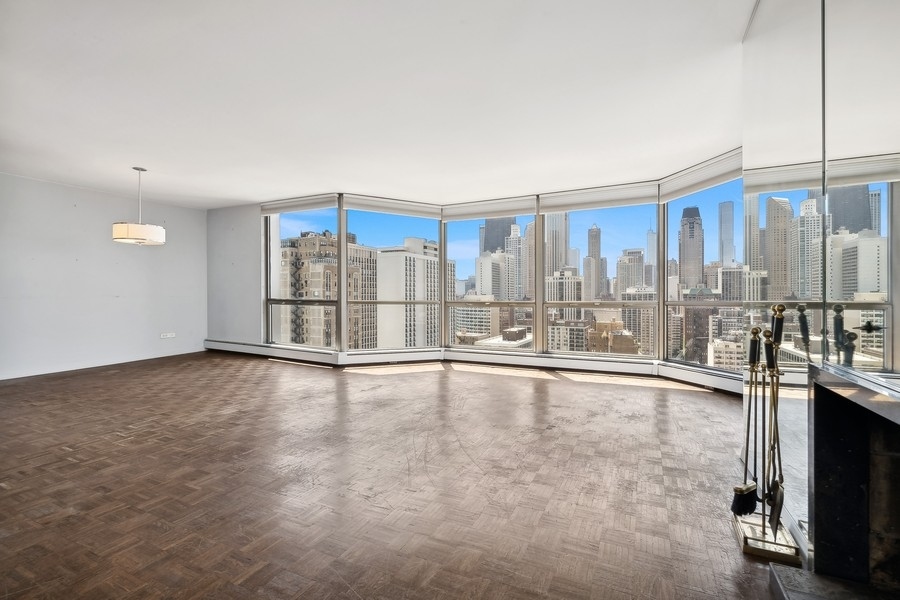 1310 North Ritchie Court, Unit 27B Chicago, IL 60610 - Photo 10 of 31 a view of an empty room with a window