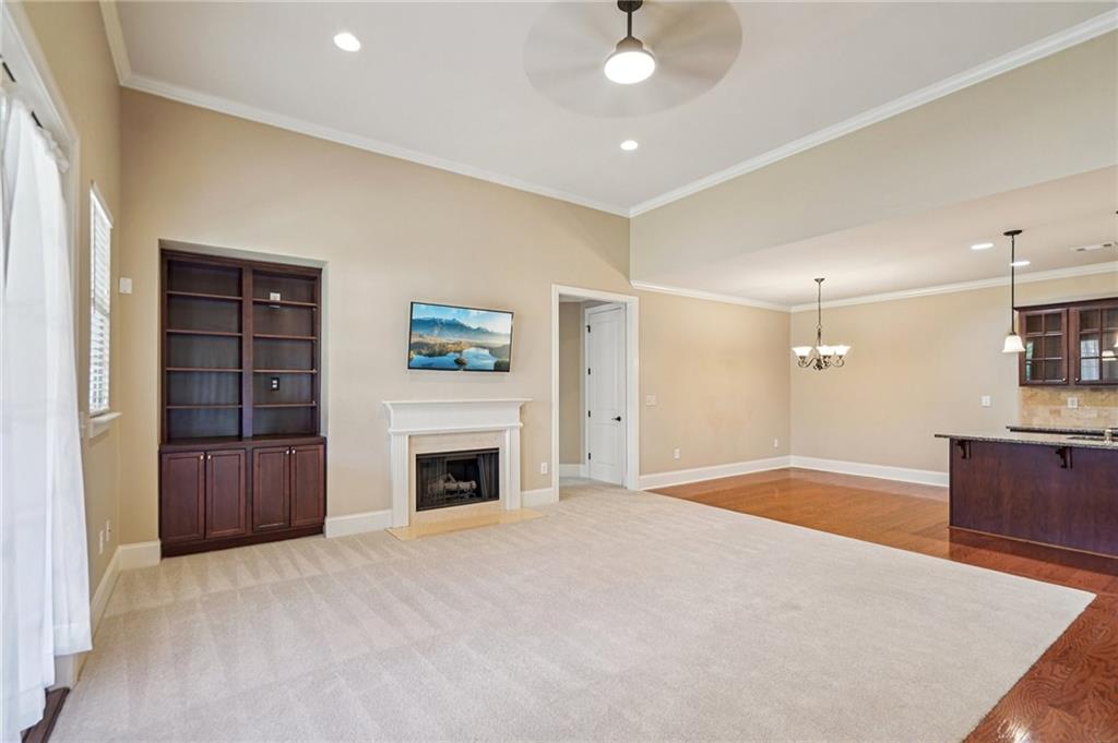 488 Townsend Street Grayson, GA 30017 - Photo 5 of 40 a view of an empty room with a fireplace and a window