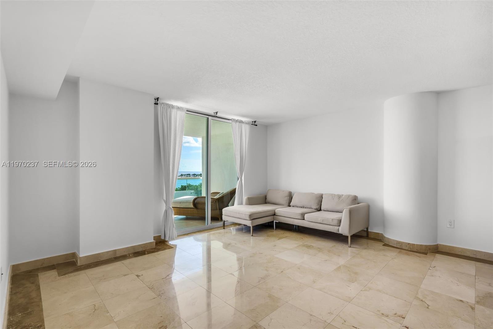 2101 Brickell Avenue, Unit 306 Miami, FL 33129 - Photo 31 of 49 a living room with furniture and a window