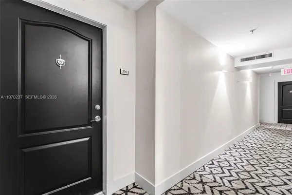 a view of a dining room with furniture and window