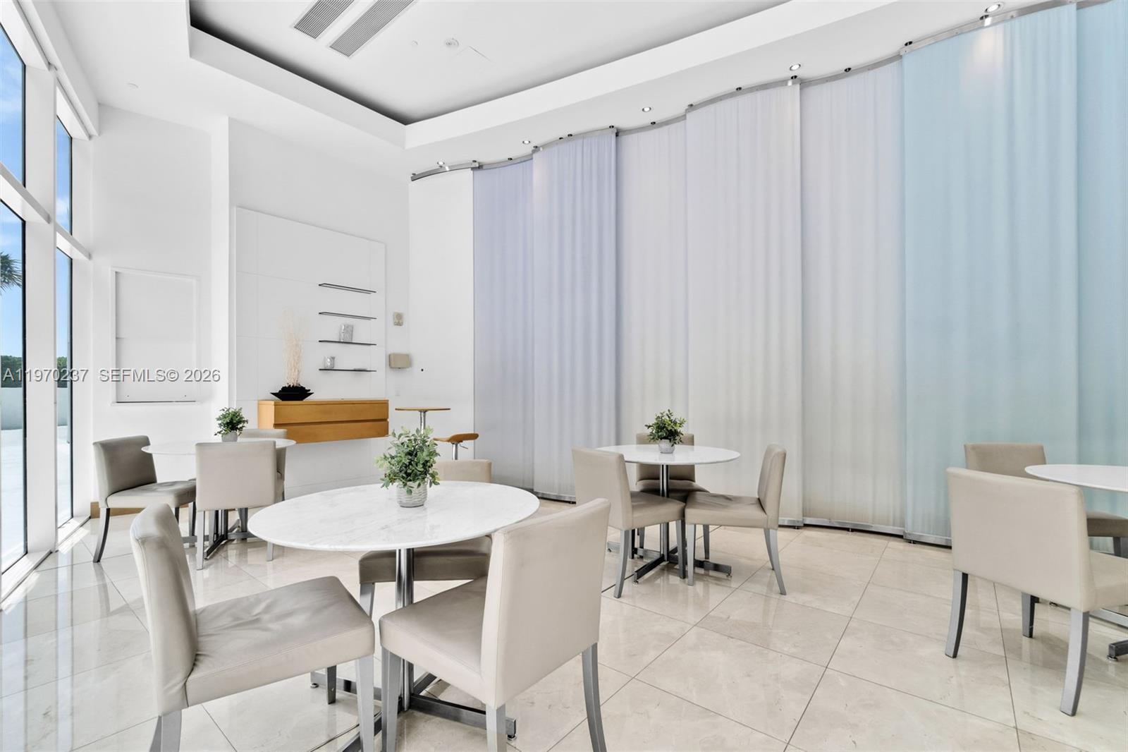 2101 Brickell Avenue, Unit 306 Miami, FL 33129 - Photo 37 of 49 a view of a dining room with furniture and window