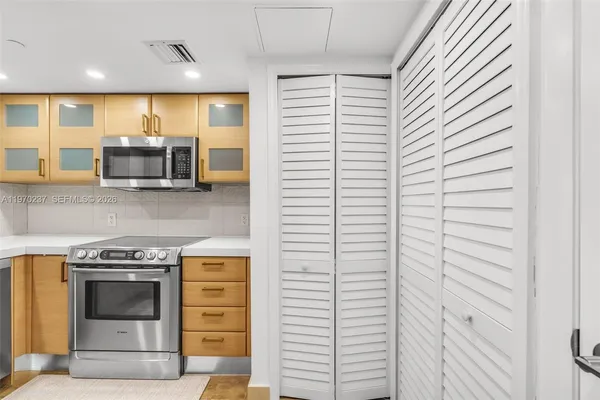 a kitchen with a stove and a microwave