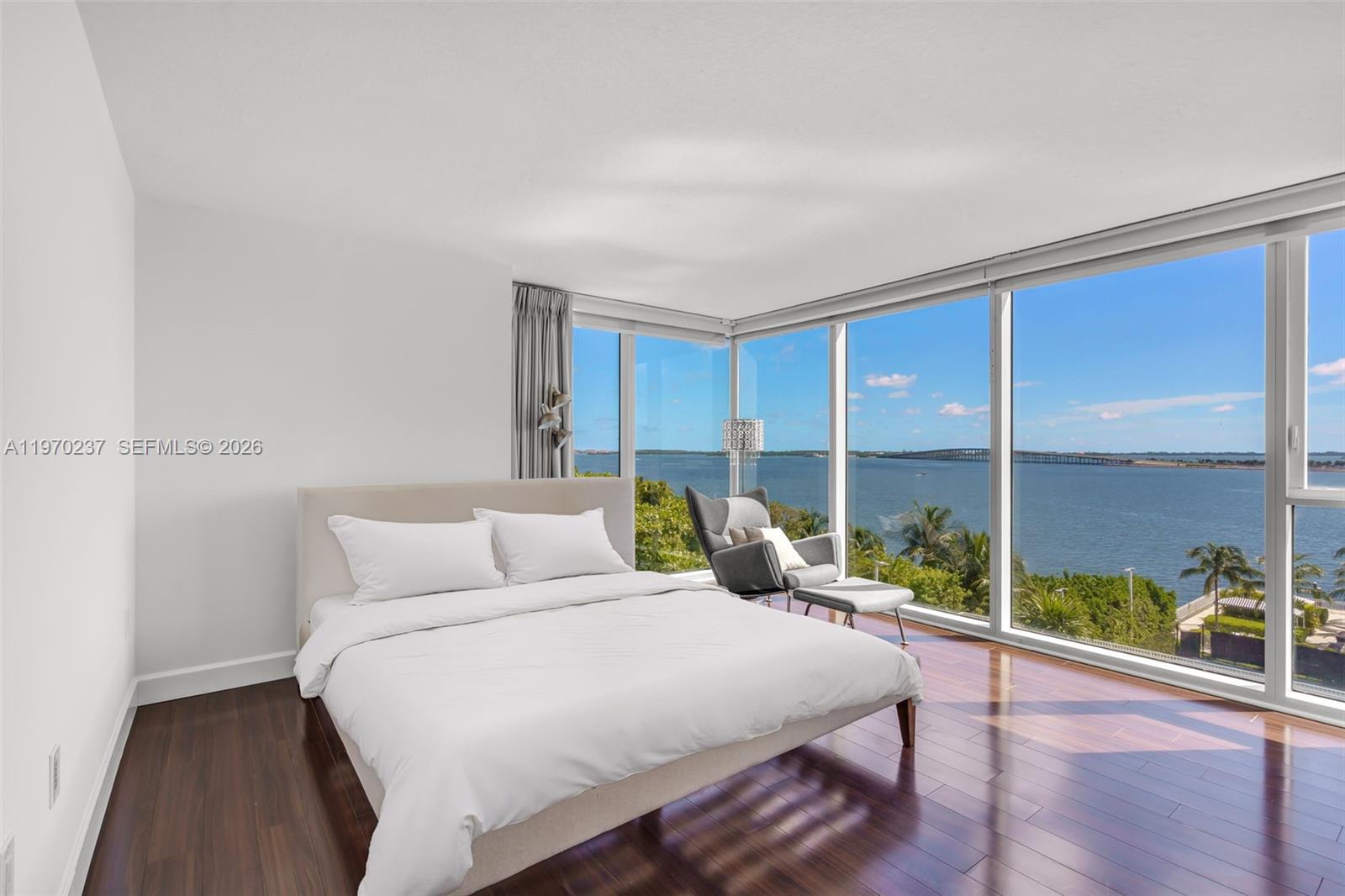 2101 Brickell Avenue, Unit 306 Miami, FL 33129 - Photo 9 of 49 a bedroom with a bed and window