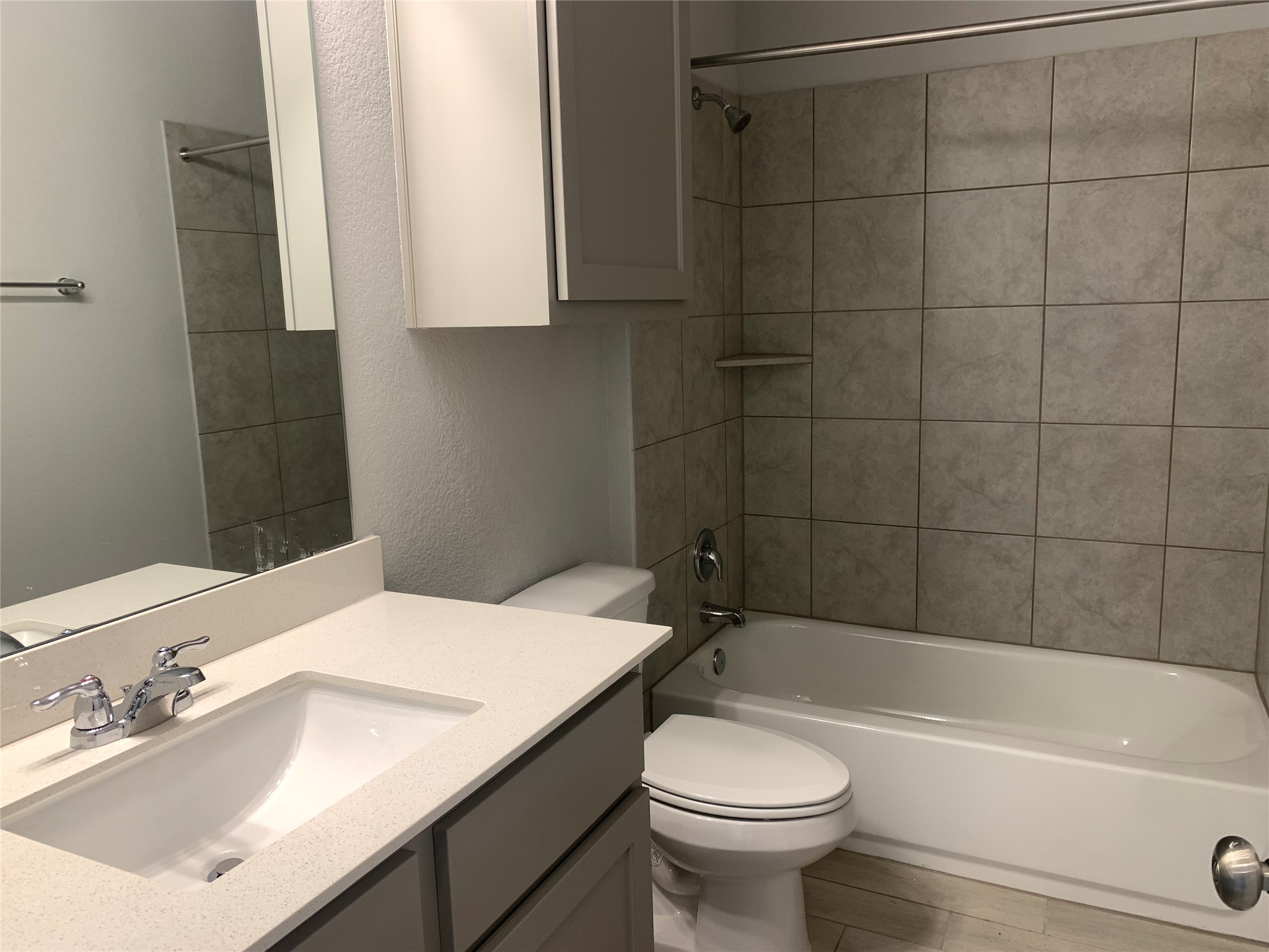 2948 Sage Ranch Drive Leander, TX 78641 - Photo 16 of 28 A well-appointed bathroom offers both a functional vanity and a combined shower-tub.