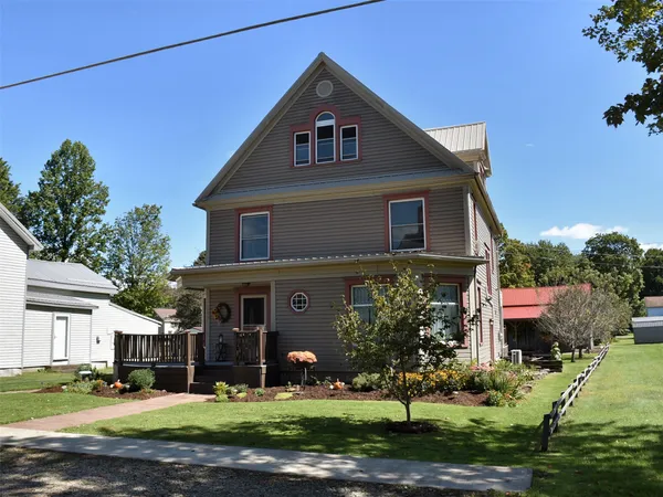 a front view of a house with a yard