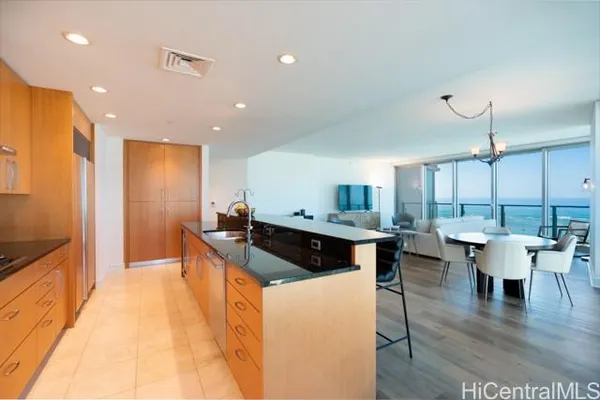 a kitchen with a table and chairs