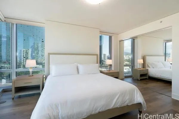 a bedroom with a bed and a couch