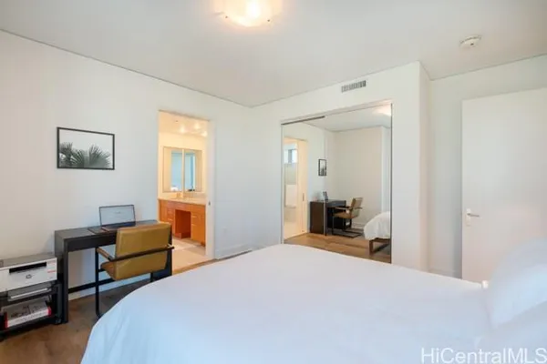 a bedroom with bed and window