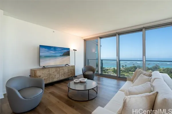 a living room with furniture and a large window