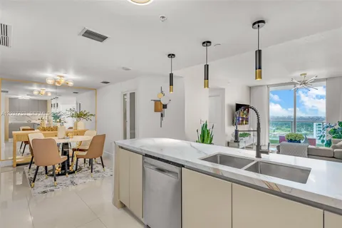 a kitchen with counter space sink and appliances