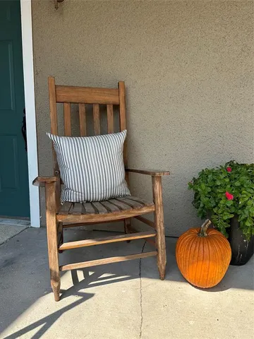 a view of a room with a potted plant and wooden floor