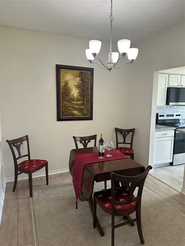 a kitchen with stainless steel appliances granite countertop a stove and a microwave