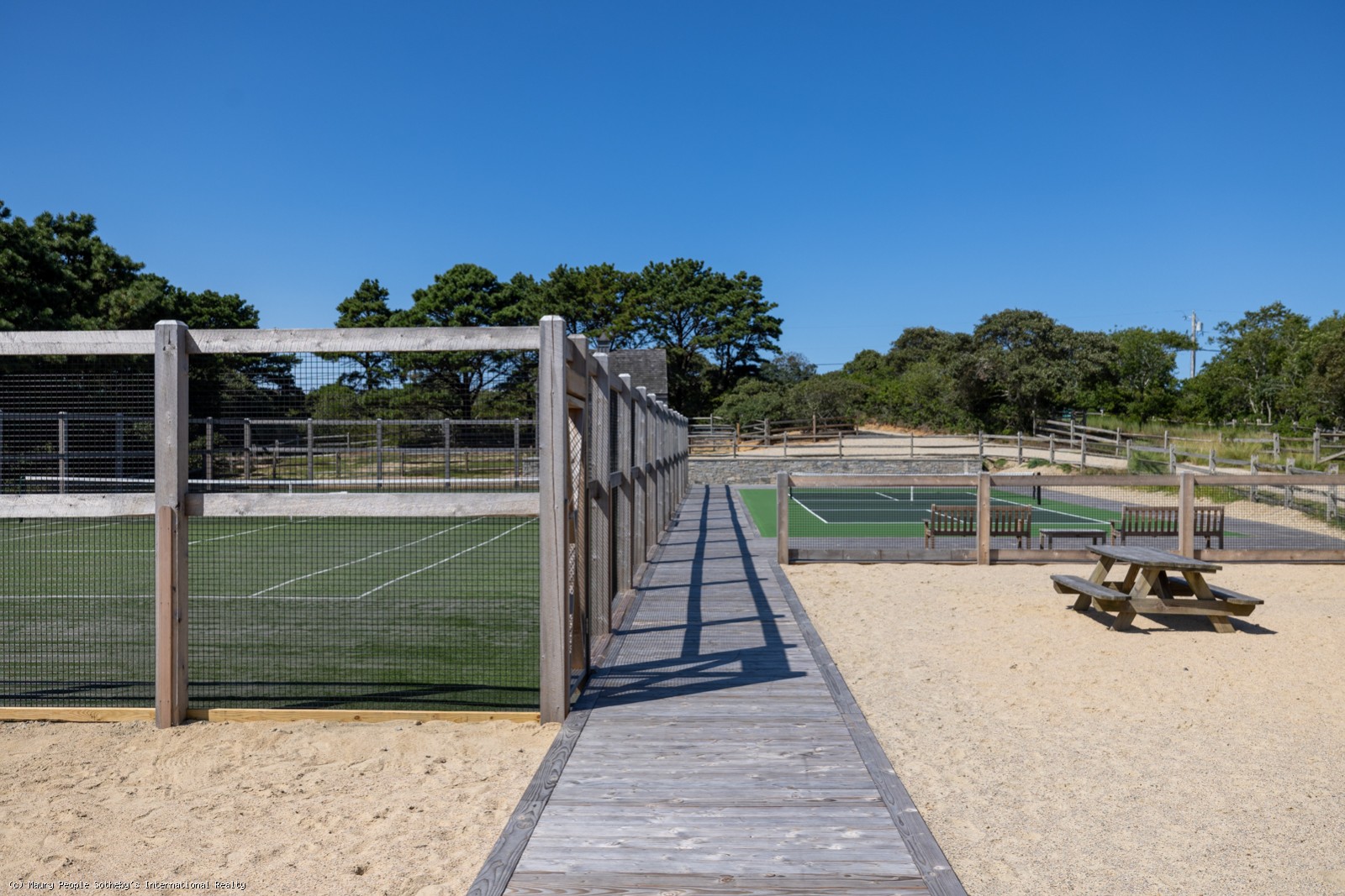 21 Quidnet Road Nantucket, MA 02554 - Photo 52 of 62 a view of a house with a ocean view