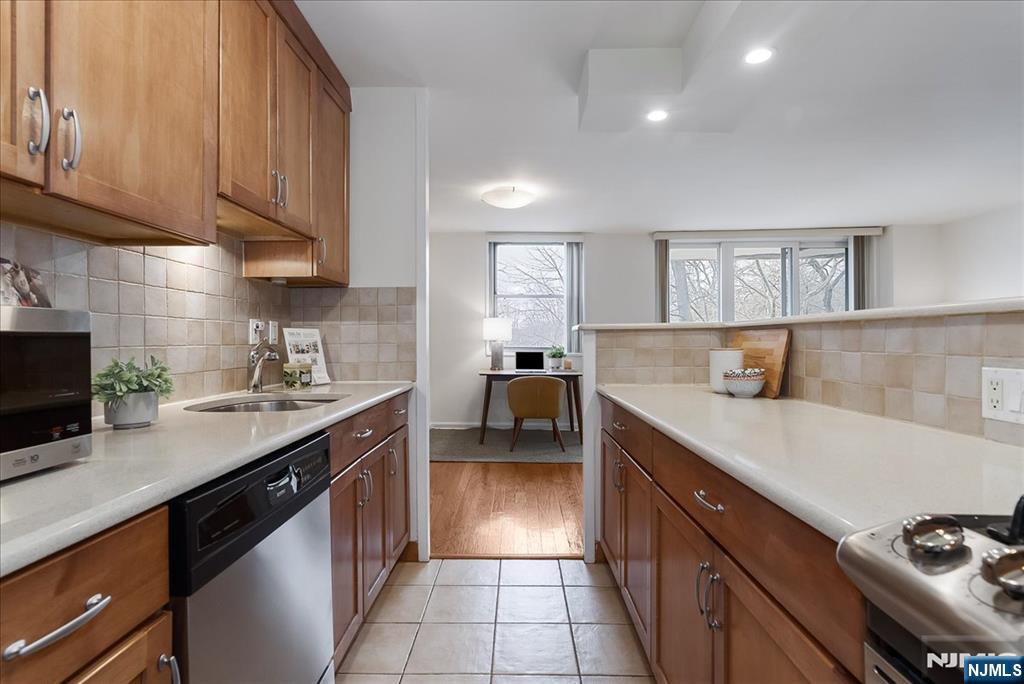 530 Valley Road, Unit C003L Montclair, NJ 07043 - Photo 13 of 25 a kitchen with a sink cabinets and appliances
