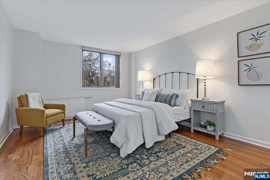 530 Valley Road, Unit C003L Montclair, NJ 07043 - Photo 15 of 25 a bedroom with a bed and a couch