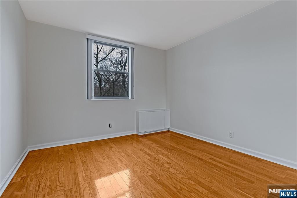 530 Valley Road, Unit C003L Montclair, NJ 07043 - Photo 19 of 25 a view of empty room with wooden floor