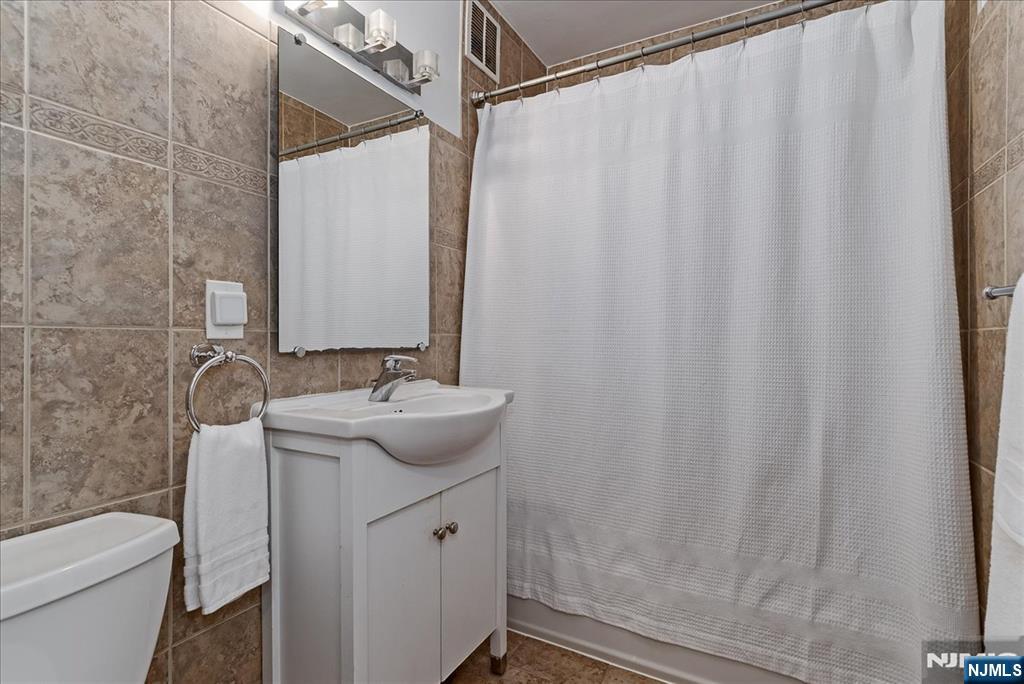 530 Valley Road, Unit C003L Montclair, NJ 07043 - Photo 20 of 25 a bathroom with a sink and a mirror