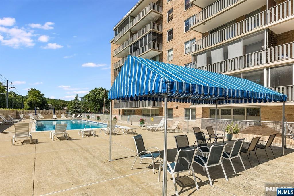 530 Valley Road, Unit C003L Montclair, NJ 07043 - Photo 23 of 25 a patio with table and chairs
