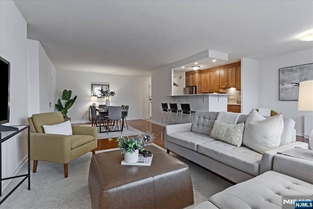 530 Valley Road, Unit C003L Montclair, NJ 07043 - Photo 3 of 25 a living room with furniture and a wooden floor
