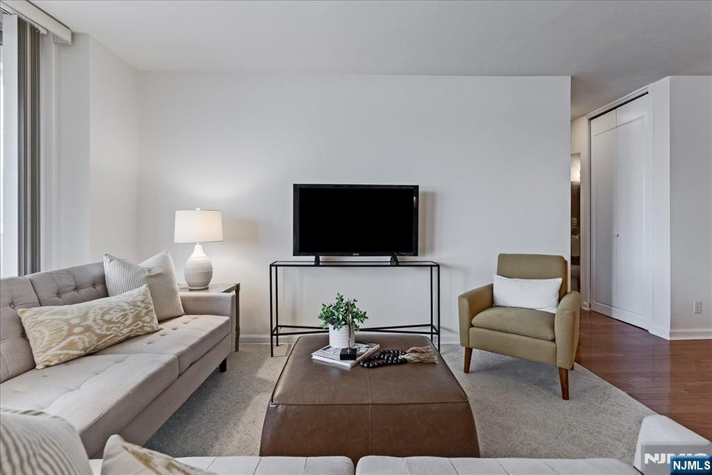 530 Valley Road, Unit C003L Montclair, NJ 07043 - Photo 5 of 25 a living room with furniture and a flat screen tv