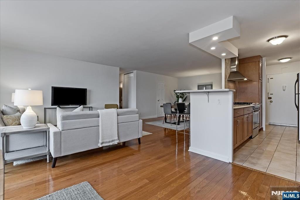 530 Valley Road, Unit C003L Montclair, NJ 07043 - Photo 6 of 25 a living room with furniture and a flat screen tv