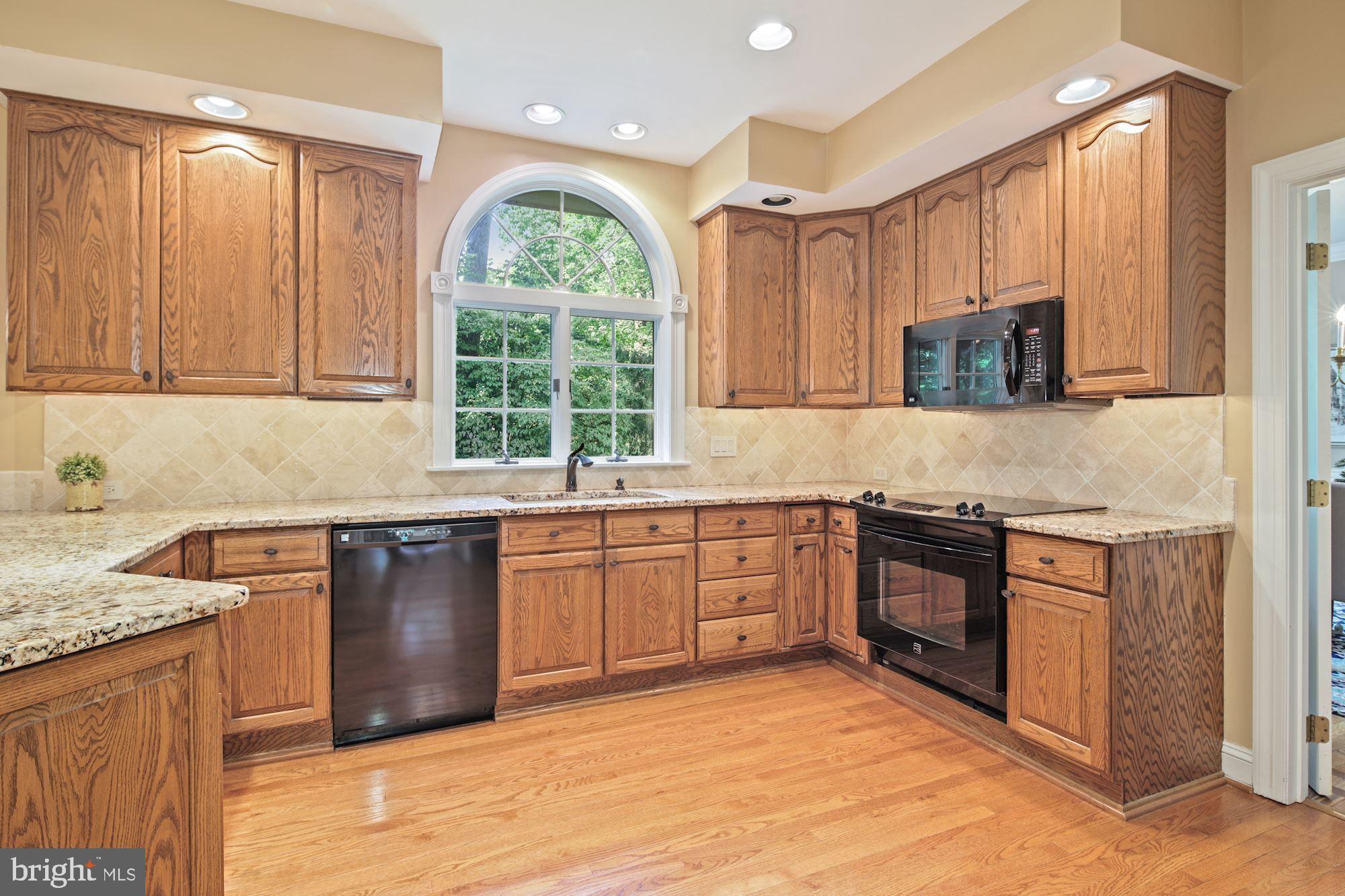 14410 Katie Road Phoenix, MD 21131 - Photo 17 of 50 Granite Kitchen w/Tumbled Marble Backsplash