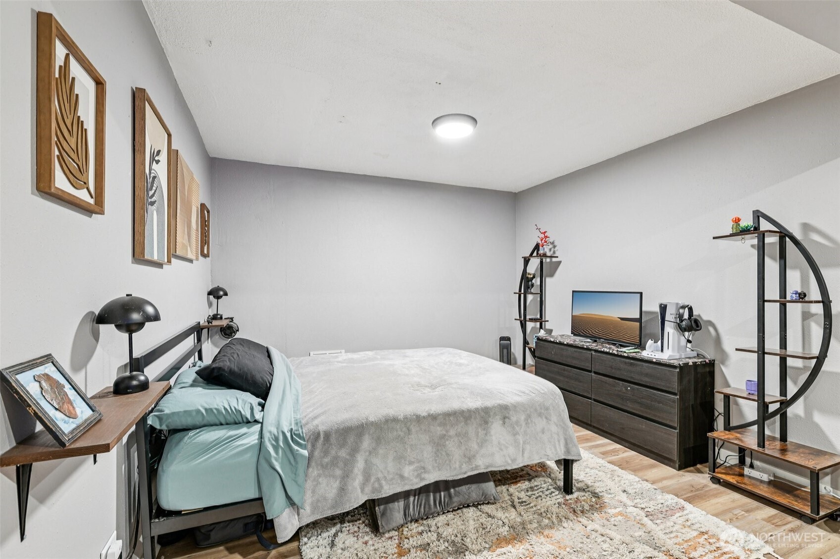 29 Maple Court Bellingham, WA 98229 - Photo 26 of 39 a bedroom with a bed and wooden floor