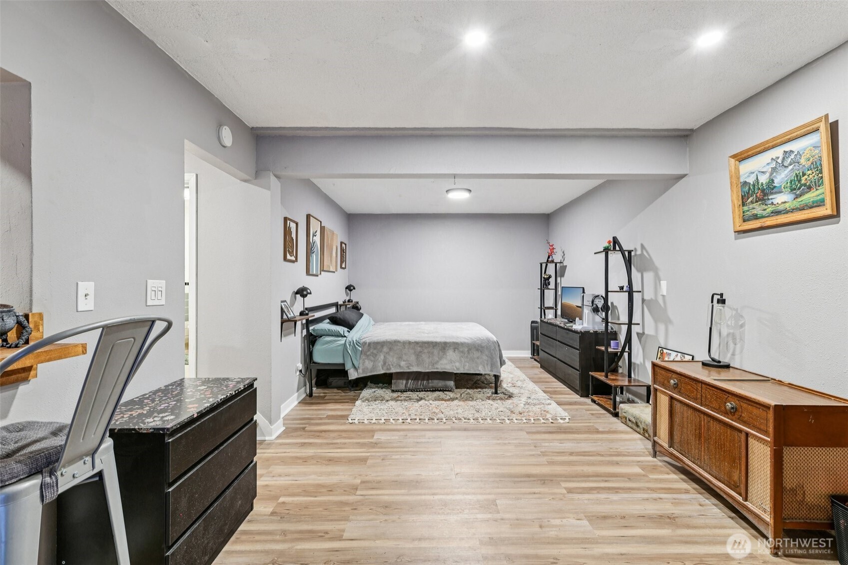 29 Maple Court Bellingham, WA 98229 - Photo 28 of 39 a living room with furniture and a wooden floor