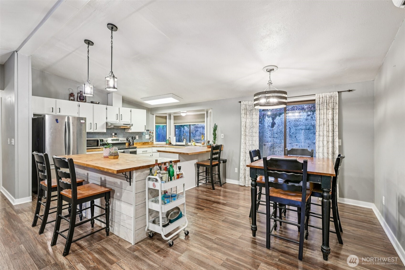 29 Maple Court Bellingham, WA 98229 - Photo 4 of 39 a view of a dining room with furniture window and wooden floor
