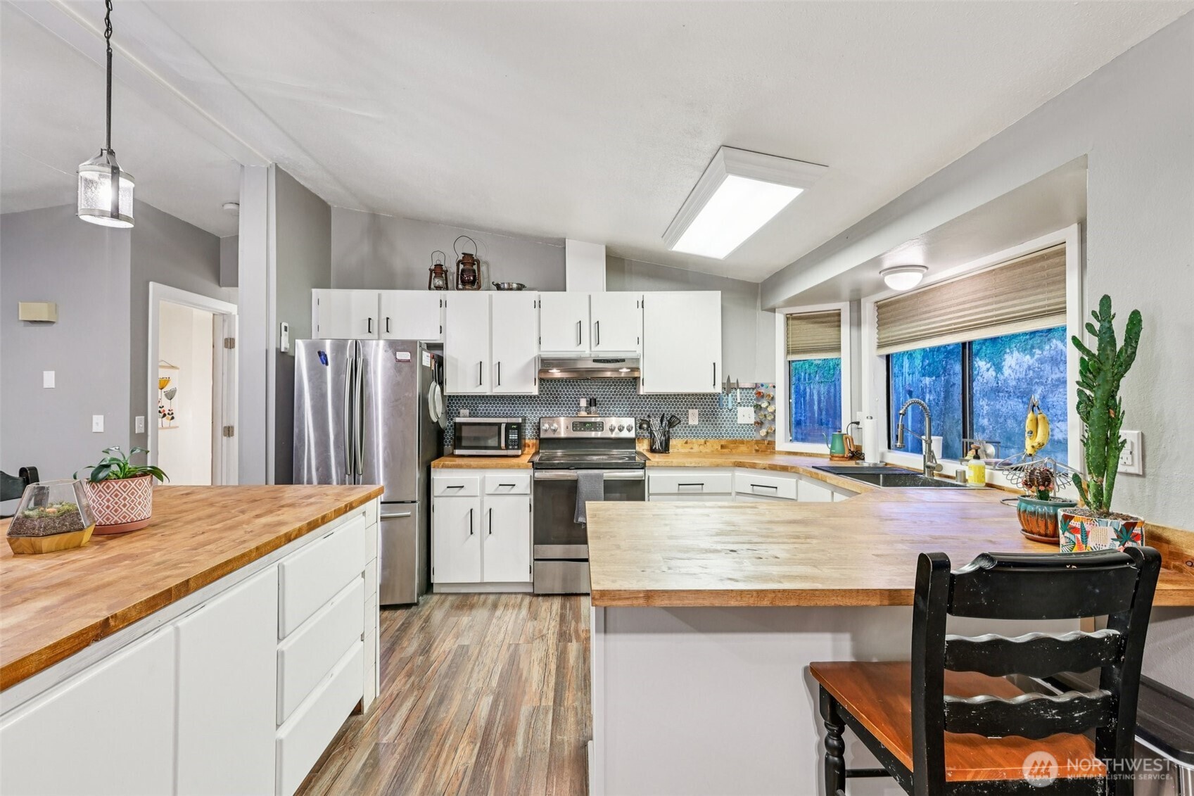 29 Maple Court Bellingham, WA 98229 - Photo 10 of 39 a kitchen with refrigerator and cabinets