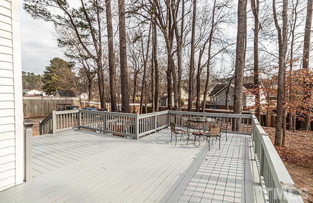 1875 Forest Wood Road Rocky Mount, NC 27804 - Photo 13 of 17 a view of a chairs and table on the wooden floor