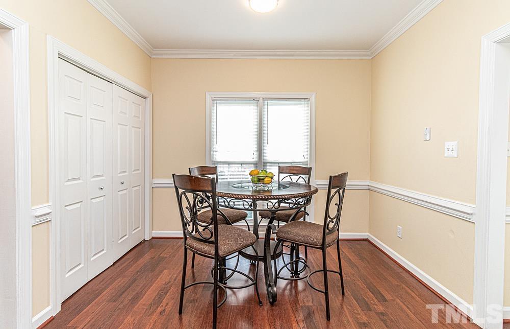 1875 Forest Wood Road Rocky Mount, NC 27804 - Photo 6 of 17 a view of a dining room with furniture and wooden floor