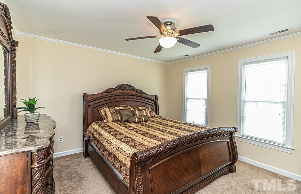 1875 Forest Wood Road Rocky Mount, NC 27804 - Photo 7 of 17 a bedroom with a bed and window