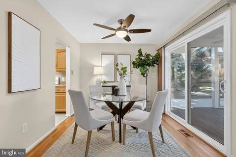 a view of a dining room with furniture and window