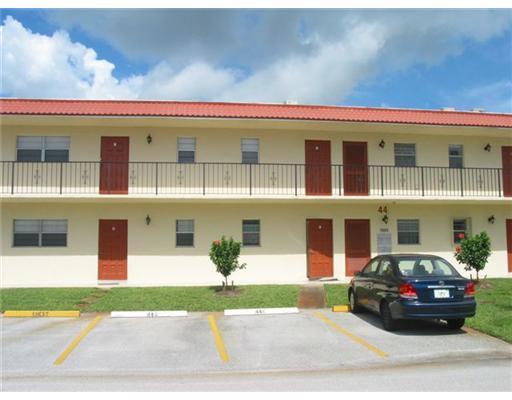 1979 Southwest Palm City Road, Unit 41B Stuart, FL 34994 - Photo 1 of 14 a view of a car parked in front of a building