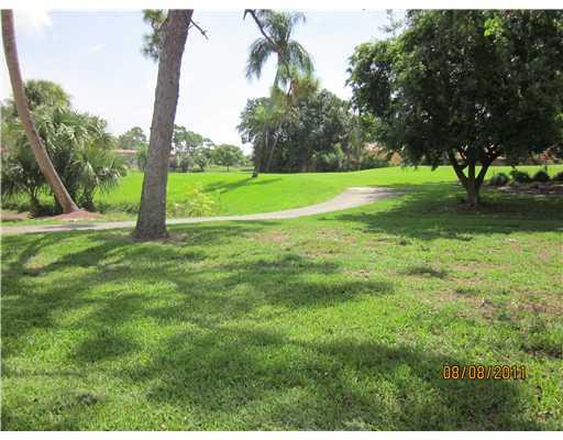 1979 Southwest Palm City Road, Unit 41B Stuart, FL 34994 - Photo 11 of 14 a view of a park with large trees