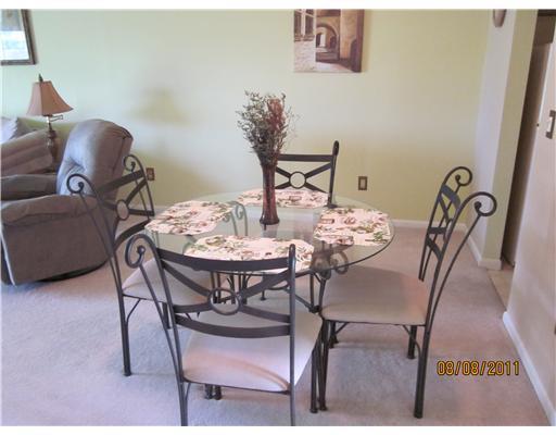 1979 Southwest Palm City Road, Unit 41B Stuart, FL 34994 - Photo 2 of 14 a view of a dining room with furniture