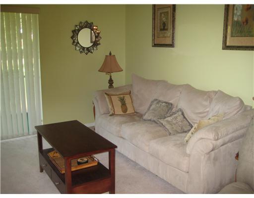 1979 Southwest Palm City Road, Unit 41B Stuart, FL 34994 - Photo 8 of 14 a bedroom with a bed and window