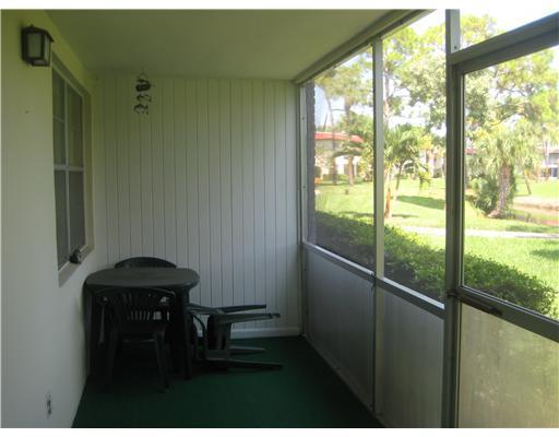1979 Southwest Palm City Road, Unit 41B Stuart, FL 34994 - Photo 10 of 14 a bathroom with a sink a mirror and a shower