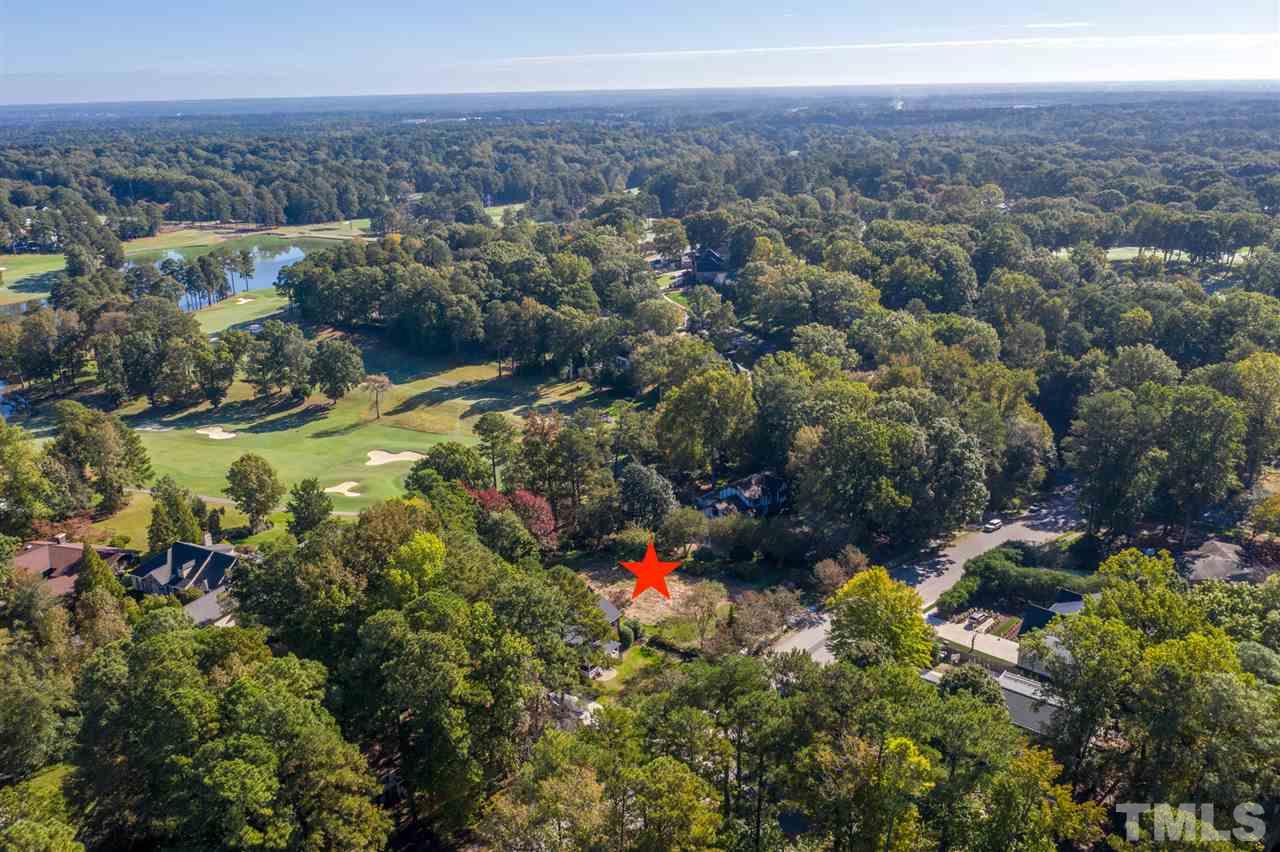 6908 Tanbark Way Raleigh, NC 27615 - Photo 9 of 10 an aerial view of residential house with outdoor space and trees