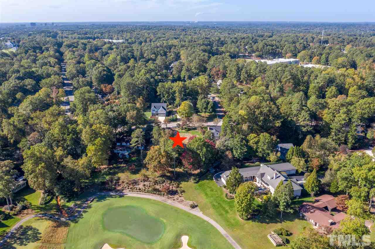 6908 Tanbark Way Raleigh, NC 27615 - Photo 10 of 10 an aerial view of a house with a yard and lake view