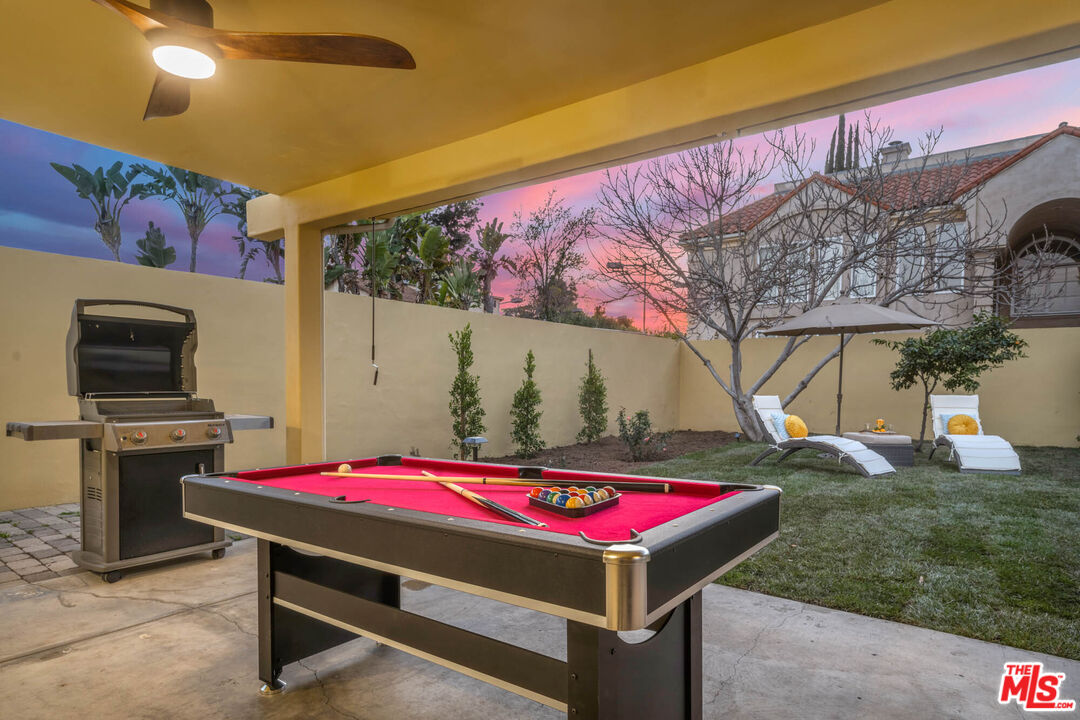 5181 Densmore Avenue Encino, CA 91436 - Photo 11 of 73 a room that has a bed and a table in it