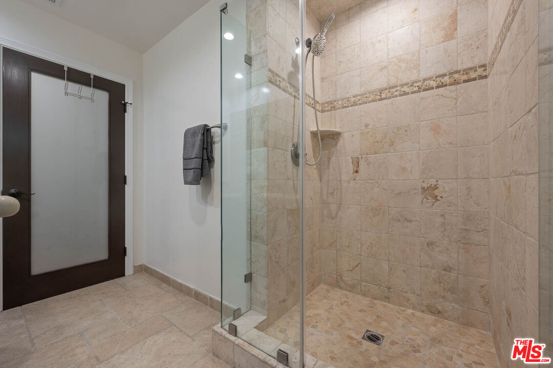5181 Densmore Avenue Encino, CA 91436 - Photo 18 of 73 a bathroom with a shower