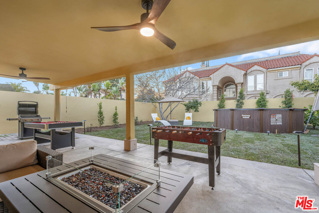 5181 Densmore Avenue Encino, CA 91436 - Photo 26 of 73 a living room with furniture and a rug